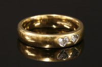 Lot 763 - An 18ct gold two stone heart shaped diamond band ring
