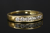 Lot 758 - A gold diamond half eternity ring