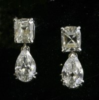 Lot 469 - A pair of white gold two stone diamond drop earrings