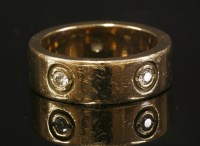 Lot 345 - A flat section gold band ring