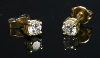 Lot 434 - A pair of single stone diamond stud earrings