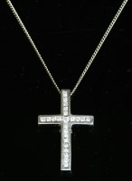 Lot 444 - A white gold diamond set cross and chain