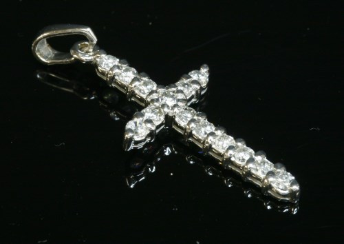 Lot 445 - An 18ct white gold diamond set cross