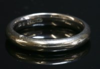 Lot 290 - An 18ct white gold band ring