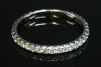Lot 404 - A diamond set full eternity ring