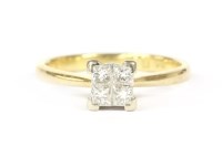 Lot 39 - An 18ct gold four stone princess cut diamond square cluster ring