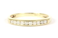 Lot 9 - A 9ct gold diamond set half eternity ring