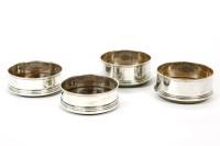 Lot 140 - Two pairs of 20th century silver bottle coasters