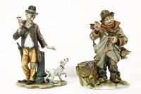 Lot 214 - A pair of Capodimonte tramp figures