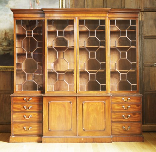 Lot 368 - A reproduction mahogany breakfront bookcase