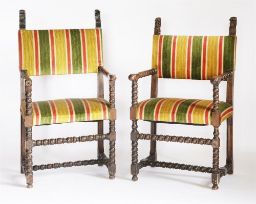 Lot 369 - A pair of walnut elbow chairs