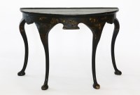 Lot 511 - A George I-style ebonised demi-lune table
