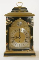 Lot 497 - A reproduction black lacquered bracket clock