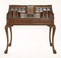 Lot 524 - A reproduction mahogany desk