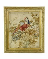 Lot 419 - An early 19th century embroidery panel of a parrot eating fruit
