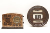 Lot 212 - A reproduction '1934' radio and a roller wall calendar
