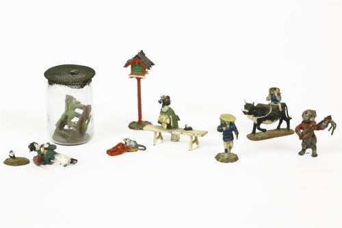 Lot 72 - Eight Japanese cold painted bronze miniature figures
