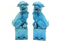 Lot 344 - A pair of blue glazed Chinese ceramic temple dogs