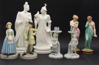 Lot 249 - A pair of Royal Worcester figural candlesticks