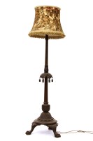 Lot 523 - A carved beech wood standard lamp