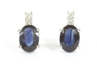 Lot 8 - A pair of white gold sapphire and diamond stud earrings