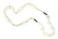 Lot 1486 - An Art Deco single row graduated colourless faceted crystal bead necklace and matching bracelet (can be joined at the clasp to make one longer necklace)