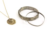 Lot 62 - An oval gold Romanesque pendant