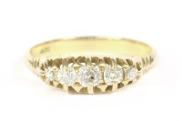 Lot 14 - A gold graduated five stone diamond ring