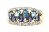 Lot 6 - A gold four row pear cut purple and blue stone and diamond ring