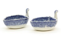 Lot 180 - A pair of early 19th century blue and white transfer printed butter boats