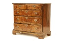 Lot 524 - A walnut and feather banded chest