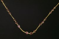 Lot 355 - A gold rhodolite garnet set chain