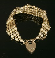 Lot 120 - A Victorian eight row gold gate bracelet
