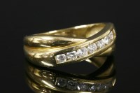 Lot 759 - An 18ct gold seven stone brilliant cut diamond crossover half eternity ring
