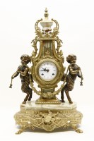Lot 379A - A Continental brass and onyx mantel clock