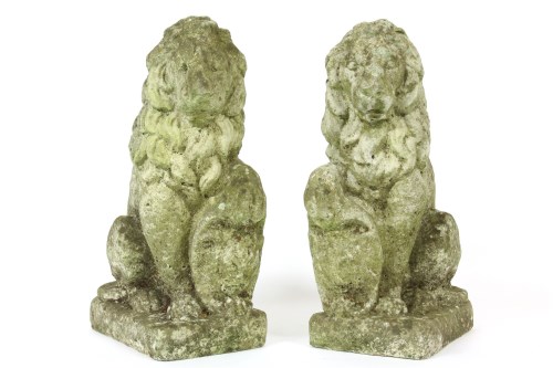 Lot 1037 - A pair of reconstituted stone lions