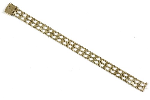 Lot 125 - A 9ct gold three row and textured square link bracelet