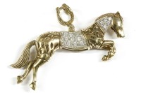 Lot 134 - A 9ct gold cubic zirconia set articulated horse pendant