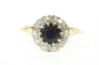 Lot 84 - An 18ct gold sapphire and diamond cluster ring