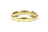 Lot 82 - A 22ct gold court shaped wedding ring