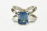 Lot 5 - A silver single stone emerald cut blue topaz ring