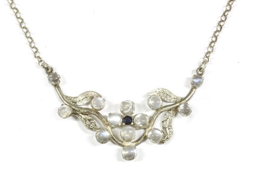 Lot 95 - A silver necklace with sapphire and moonstone cabochon floral centrepiece