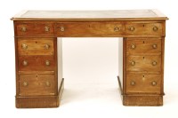 Lot 575 - A Victorian mahogany nine drawer twin pedestal desk