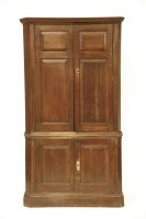 Lot 569 - A George III oak standing corner cabinet
