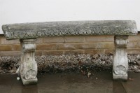 Lot 1061 - A cast stone curved bench