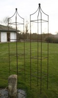 Lot 1076 - A pair of hand forged wrought iron square garden obelisks
