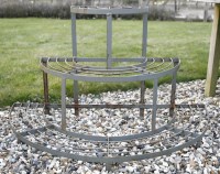 Lot 1080 - A hand forged wrought iron three tier plant stand