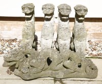 Lot 1094 - Four reconstituted stone griffins