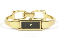 Lot 98 - A ladies gold plated Gucci quartz bangle watch