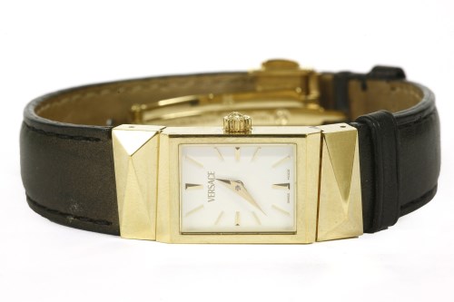 Lot 50 - A ladies gold plated Versace quartz strap watch